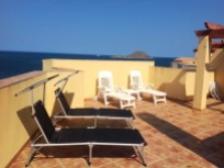 The private rooftop terrace is included with four sun loungers.